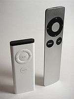 Apple's original white IR remote and the newer aluminum one.