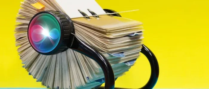 Picture of a Rolodex on a yellow background.