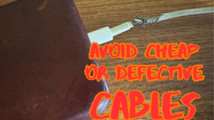 iPhone being charged by a cable that is frayed and almost completely broken. Red overlay text says avoid cheap or defective cables