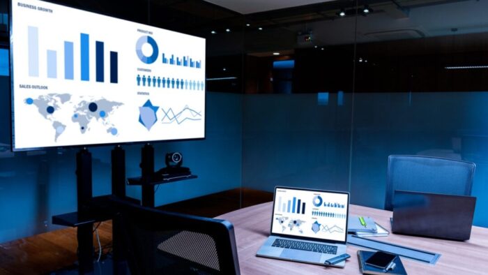 realistic AI-generated image of a conference room with a large screen mirroring the laptop screen on the table.