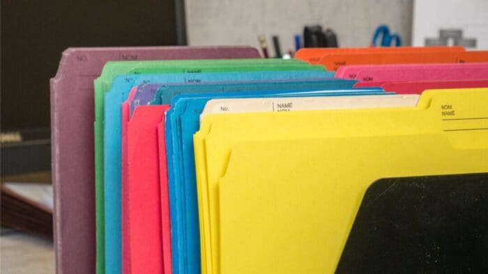 close up of a set of manila folders in a rainbow of colors