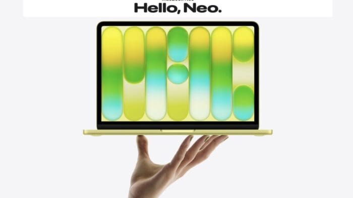 screen shot from Apple's website shows a hand holding up a citrus yellow MacBook Neo. Text at the top reads "Hello, Neo."