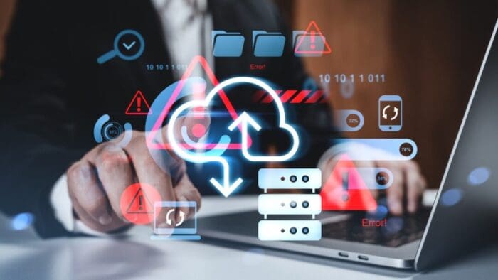 background is a person typing on a laptop. overlay is a bunch of computerized symbols and drawings. most prominent drawing is of a cloud with arrows pointing both up and down.